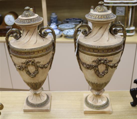 A pair of plaster urns height 57cm